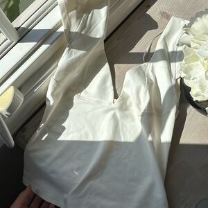 Only worn once white three people top